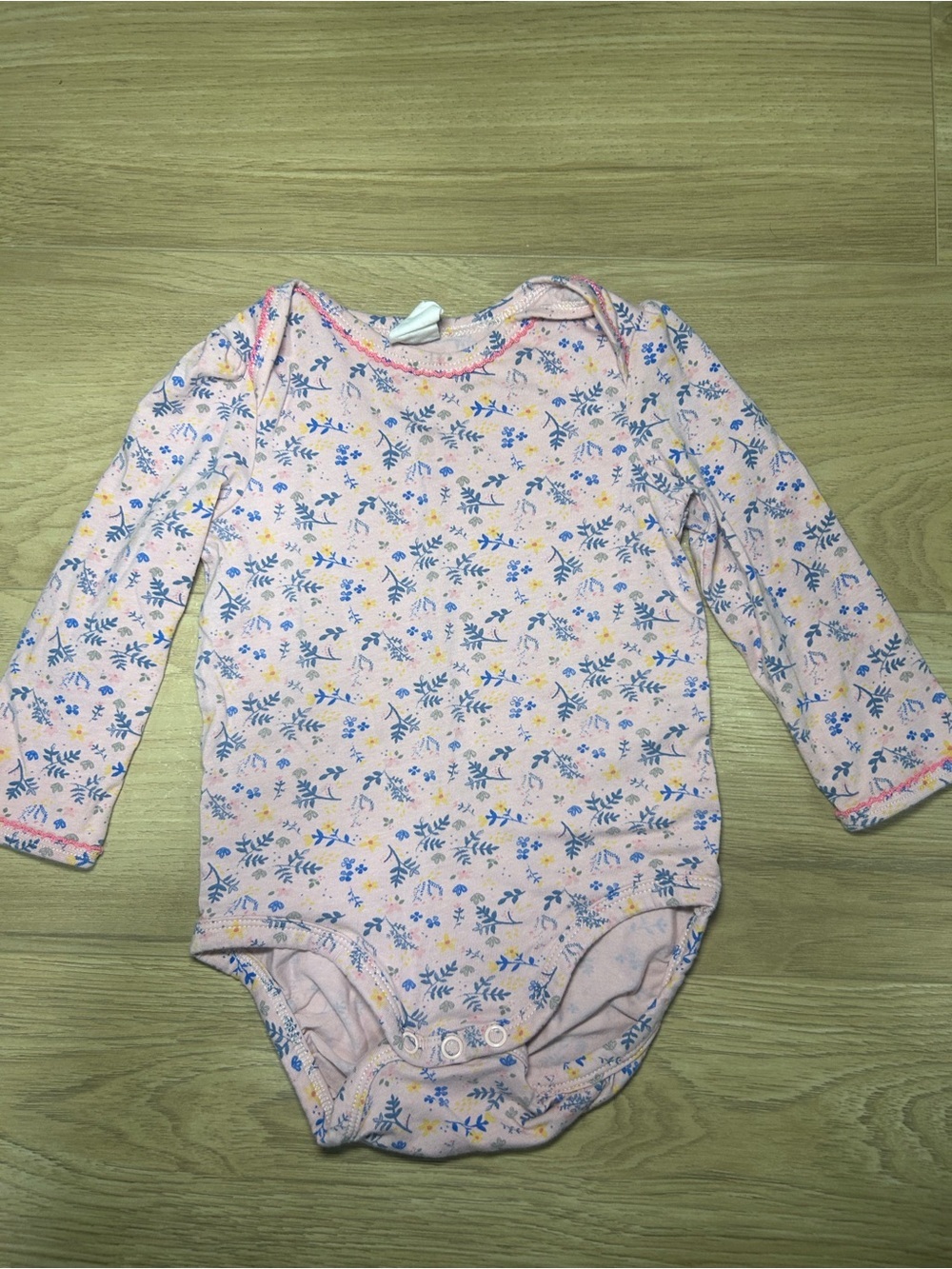 H&M Pink Floral Long-Sleeve Baby Bodysuit with Blue and Yellow Accents